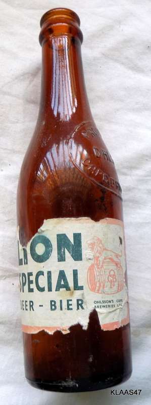 VINTAGE - OHLSSONS CAPE BREWERIES - EMPTY BOTTLE - PAPER LABEL LION SPECIAL BEER