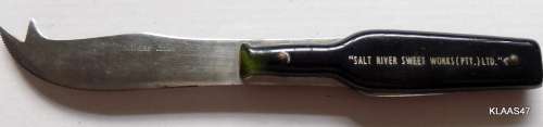 STAINLESS STEEL CHEESE KNIFE - BOTTLE SHAPED HANDLE - `SALT RIVER SWEET WORKS (PTY) LTD`