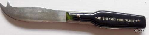 STAINLESS STEEL CHEESE KNIFE - BOTTLE SHAPED HANDLE - `SALT RIVER SWEET WORKS (PTY) LTD`