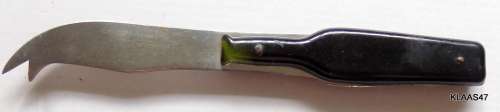 STAINLESS STEEL CHEESE KNIFE - BOTTLE SHAPED HANDLE - `SALT RIVER SWEET WORKS (PTY) LTD`