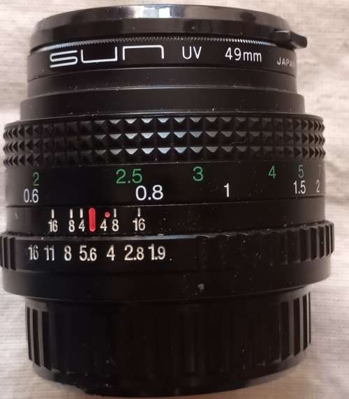 Auto Chinon 50mm Lens (Made in Japan) with Sun UV 49mm Skylight - Caps both ends