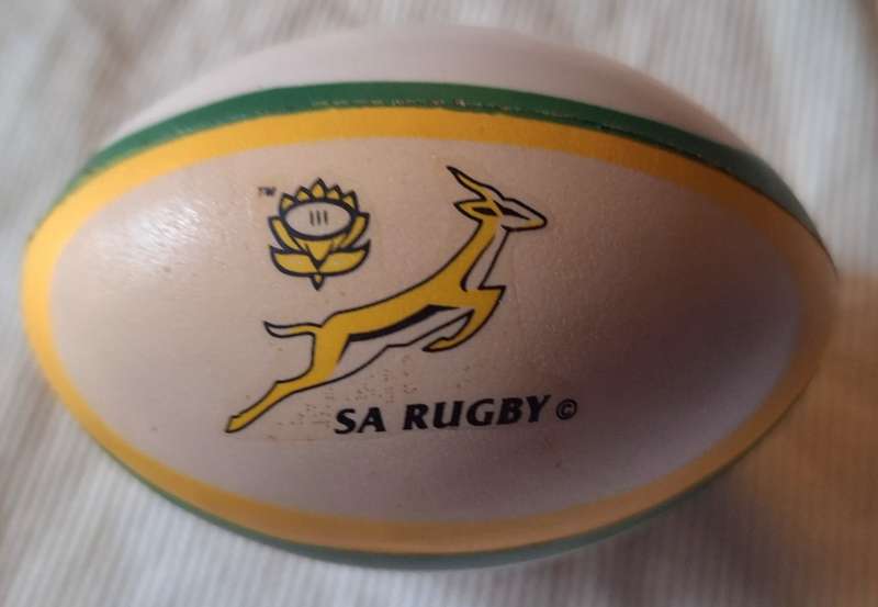 Rugby Shaped Stress ball with S.A. Rugby and Wellington VO Brandy