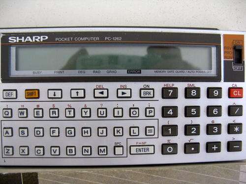 SHARP PC-1262 POCKET COMPUTER : WORKING : BATTERIES NOT INCLUDED : MANUAL FOR PC-1251