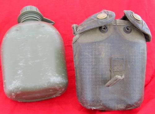 WATER BOTTLE  IN COVER   PLEASE SEE PICTURES (look at pattern of cover-not usual canvas)