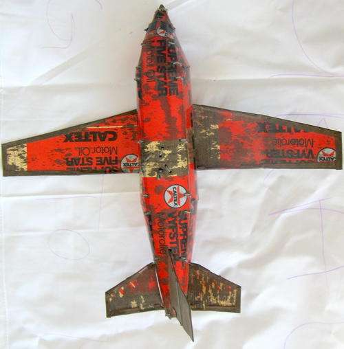 VINTAGE : MODEL PLANE : HANDMADE FROM CALTEX TIN : 25cm LONG - 28cm ACROSS WING