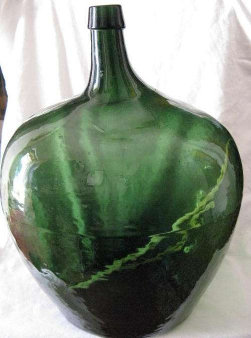 DEMIJOHN : GREEN GLASS : 49CM HIGH : 23CM ACROSS  : WEIGHS 4.965KG