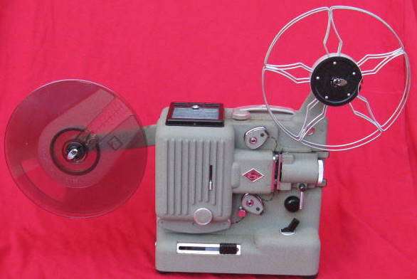 EUMIG P 8 : 8MM PROJECTOR : MADE IN AUSTRIA : NOTE TAPE ON WIRE NEAR PLUG : ONE EXTRA KODAK REEL INC