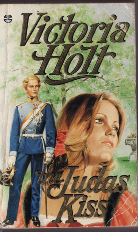 THE JUDAS  KISS  BY VICTORIA  HOLT  THE BOOK HAS GONE BROWN  SOME WRITING  FRONT OF BOOK