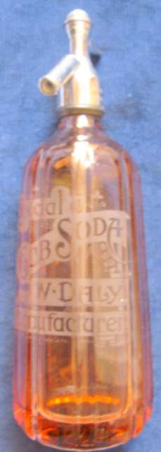 W.DALY - MANUFACTURER : SPECIAL CLUB SODA : EMPTY PINK/BROWN BOTTLE
