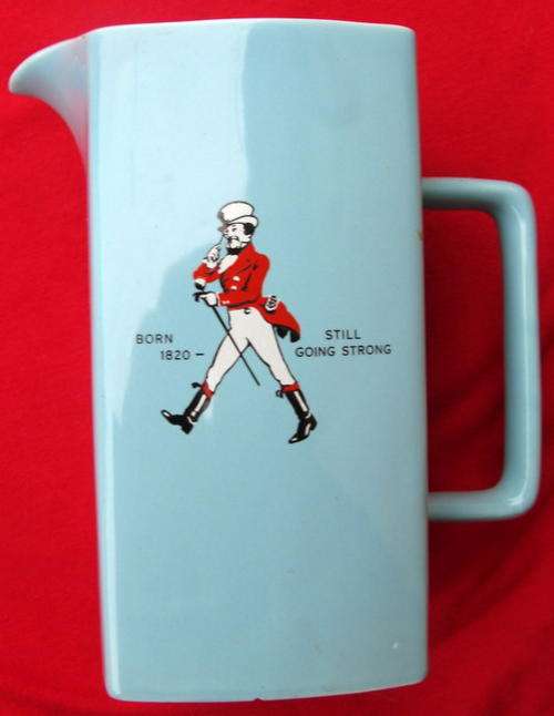 WADE : ENGLAND : JOHNNIE WALKER: JUG - 15.5cm HIGH - 8.5cm SQUARE BASE : **SMALL CHIP ON BASE**
