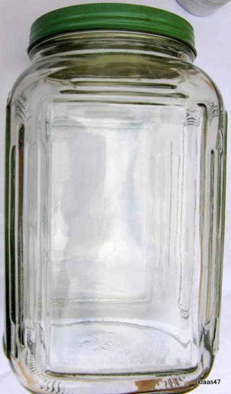 LARGE GLASS STORAGE JAR : GREEN METAL SCREW ON TOP : 24.5cm HIGH - 14x14cm BASE - LID DIAM 11.5cm