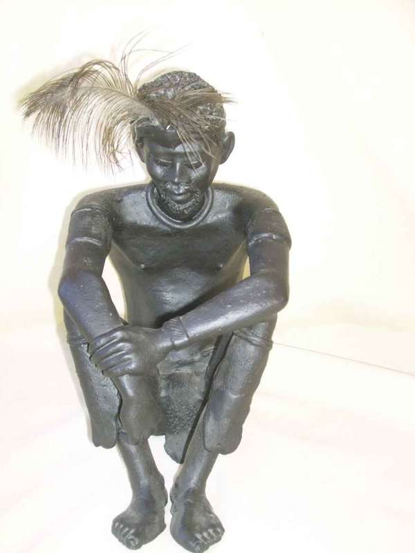 CAST IRON STATUE `MAN SEATED` BY DUDUZILE NDLOVU