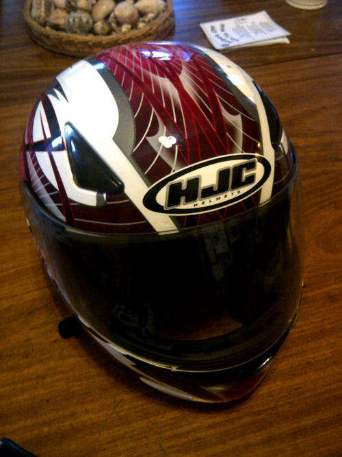New-condition HJC motorbike helmet, medium 57 -58cm (4 months old)