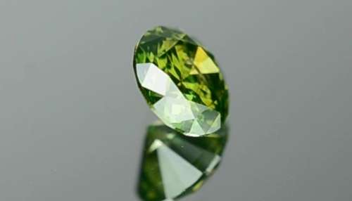 Matching Pair of 1.03tcw Fancy Vivid Green Brilliant Round Cut Natural Diamonds! R72 500