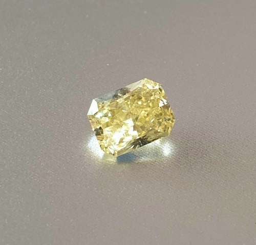 Magnificent Natural Fancy VIVID YELLOW  Radiant Cut Diamond: 0.53ct Round Cut VVS1!