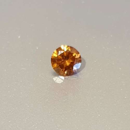 A Superb 0.34ct Natural Round Brilliant Cut Fancy Orange Diamond SI2