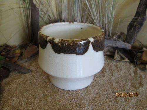 Pottery pot. Brown over White
