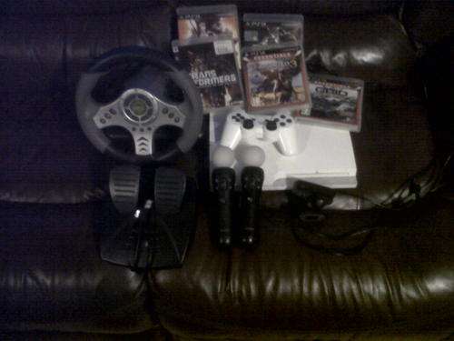 White ps3 320GB console 2 remotes 5 games eye camera and psp console