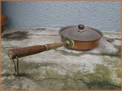 Vintage copper and brass pot/pan with wooden handle.