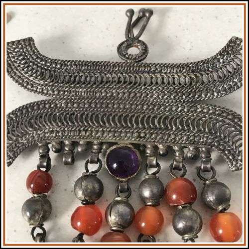 Vintage Yemenite brooch. Filigree with dangling beads.