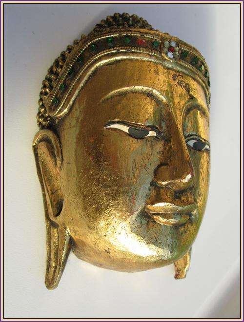 Wooden mask, gilded. Buddha Thailand.