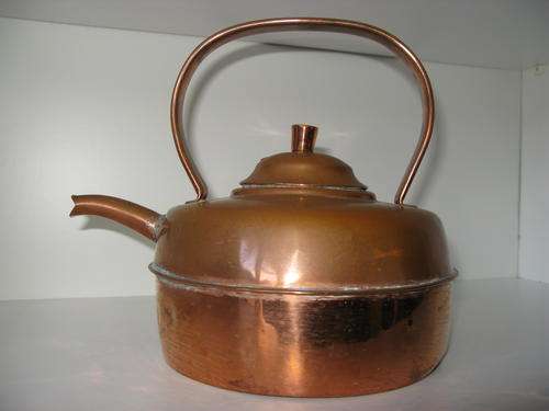 Vintage copper kettle. Mended with damage.
