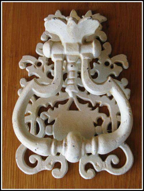 Door Knocker. Metal painted white. Made to look old.