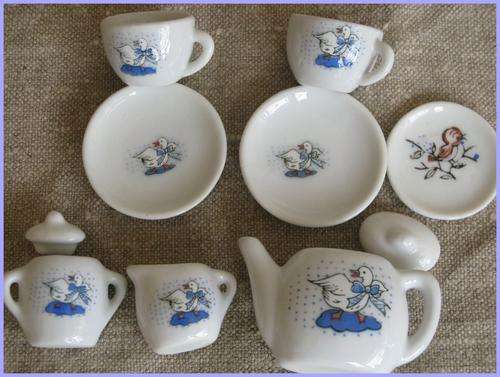 Doll's tiny porcelain tea set. Mother Goose.