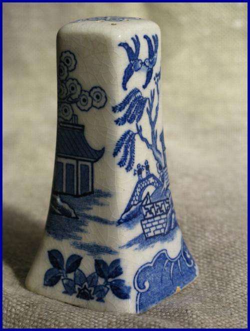 Salt shaker. Blue 'Willow' pattern old earthenware.