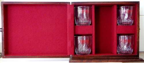 A Lined Wooden Display Box and Four Whisky Glasses