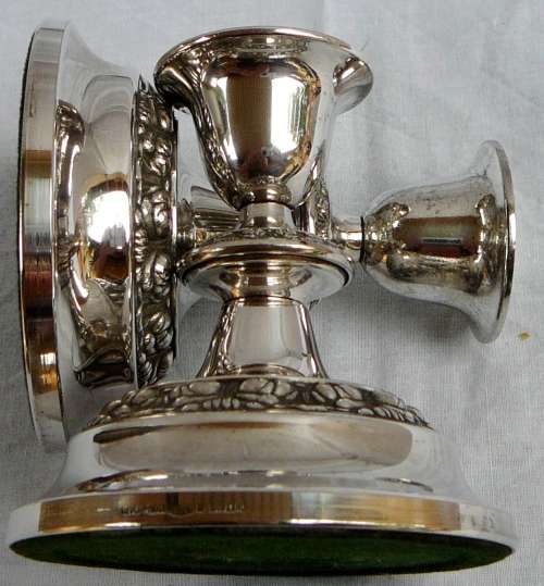 A Pair of Silver Plated Candle Holders by IANTHE