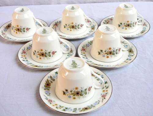 A Royal Doulton Cup and Saucer Duo 'Pastorale'