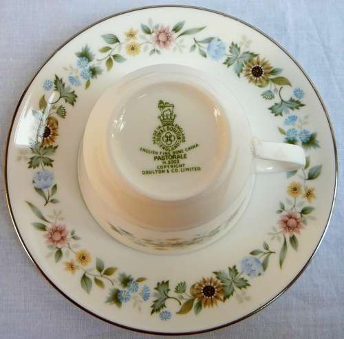 A Royal Doulton Cup and Saucer Duo 'Pastorale'