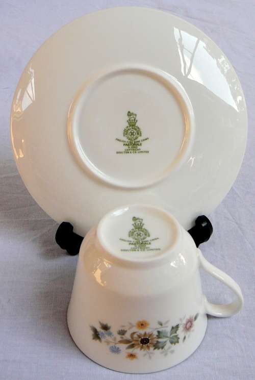 A Royal Doulton Cup and Saucer Duo 'Pastorale'