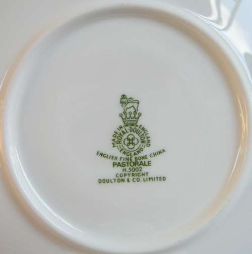 A Royal Doulton Cup and Saucer Duo 'Pastorale'