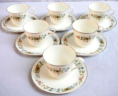 A Royal Doulton Cup and Saucer Duo 'Pastorale'