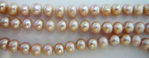A Beautiful 3 Strand Real Pink Pearl Necklace with Mother of Pearl Clasp.