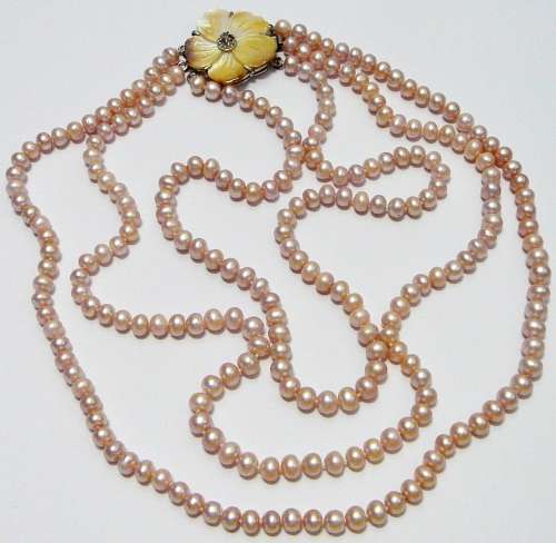 A Beautiful 3 Strand Real Pink Pearl Necklace with Mother of Pearl Clasp.