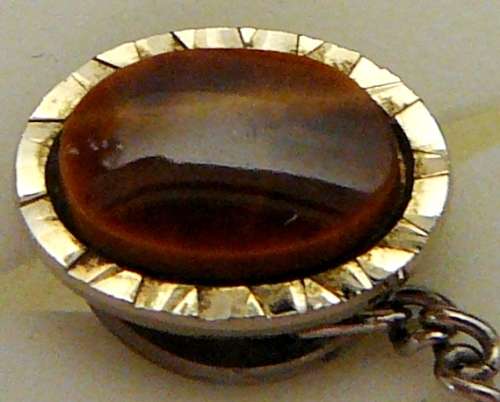 A Tigers Eye Tie Pin with Chain