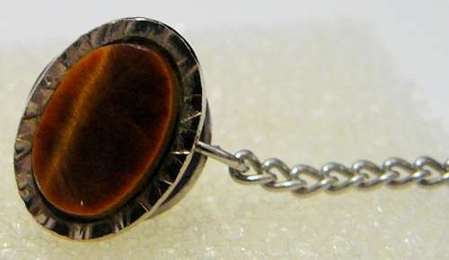 A Tigers Eye Tie Pin with Chain