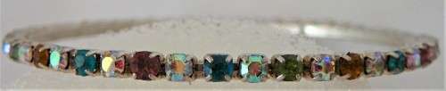 A Multi Coloured Diamante Bangle set into Silver Coloured Metal