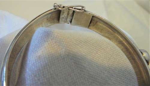 A Very Tasteful Sterling Silver Bangle set with a White Opal & 2 Precious Opals