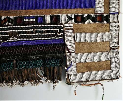 A Hand Made Glass Bead and Leather African Wall Hanging