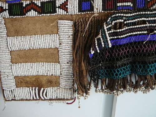 A Hand Made Glass Bead and Leather African Wall Hanging