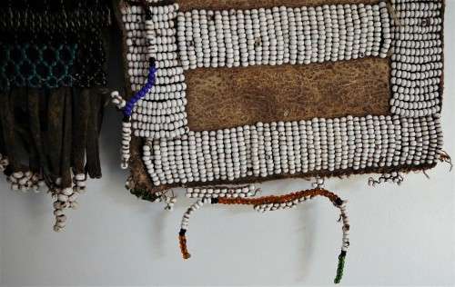 A Hand Made Glass Bead and Leather African Wall Hanging