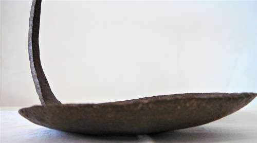 A Very Interesting Hand Beaten African Iron Lamp with Handle