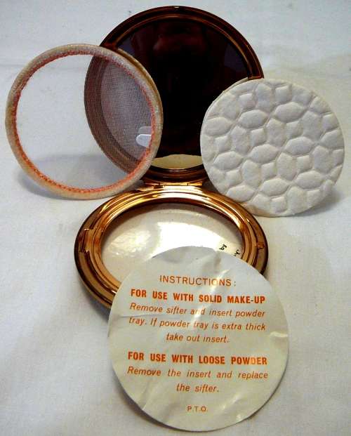 An Unused Convertible Powder Compact by Stratton