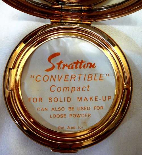 An Unused Convertible Powder Compact by Stratton