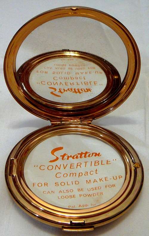 An Unused Convertible Powder Compact by Stratton