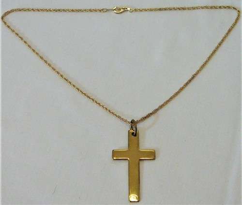 A Gold Coloured Cross on a Chain